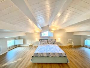 A bed or beds in a room at Al Teatro di Tavignano