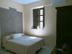 Cama o camas de una habitación en Estación de Coripe