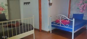 Postel nebo postele na pokoji v ubytování Maya guest house@coffee