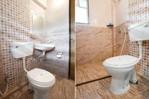 a bathroom with a toilet and a sink and a shower at FabHotel Vardhan House II in Dāpuri