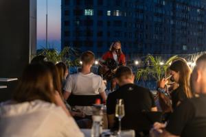 a woman standing in a room with a group of people at WOL 121 by Ribas in Odesa