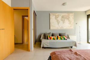 a bedroom with a bed and a map on the wall at Apt.p/5 15min from Barcelona and Beaches W/Terrace in Sant Adria de Besos