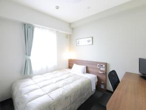 Letto o letti in una camera di Hotel Econo Tsu Station