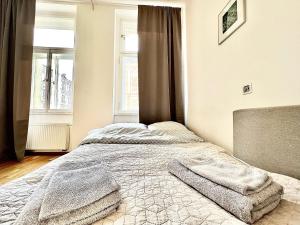 Postel nebo postele na pokoji v ubytování Maison Residence Prague