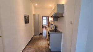 a kitchen with a sink and a counter top at commodious 3BR Apt. Ideal for Families and Friends in Vienna