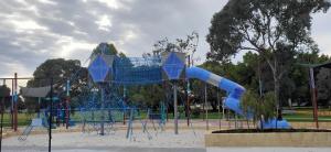 a playground with a blue slide in a park at Balcatta Sanctuary in Perth