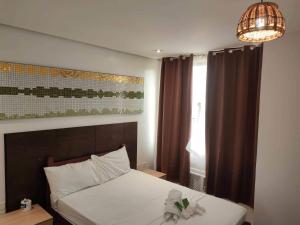 Postel nebo postele na pokoji v ubytování Hotel Rupert A Baler
