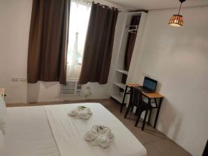 Postel nebo postele na pokoji v ubytování Hotel Rupert A Baler