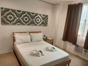 Postel nebo postele na pokoji v ubytování Hotel Rupert A Baler