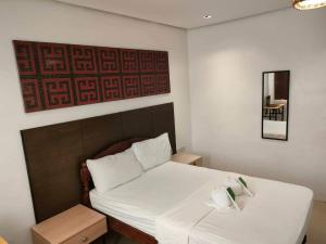 Postel nebo postele na pokoji v ubytování Hotel Rupert A Baler
