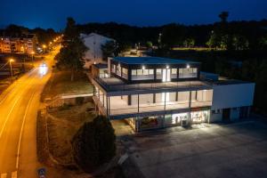 an aerial view of a house at night at Hotel Potpican in Potpićan