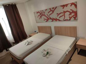 Postel nebo postele na pokoji v ubytování Hotel Rupert A Baler