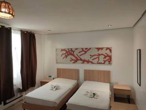 Postel nebo postele na pokoji v ubytování Hotel Rupert A Baler