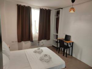 Postel nebo postele na pokoji v ubytování Hotel Rupert A Baler