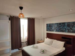 Postel nebo postele na pokoji v ubytování Hotel Rupert A Baler
