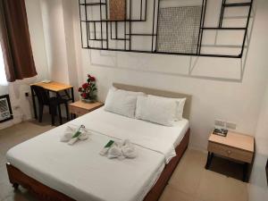 Postel nebo postele na pokoji v ubytování Hotel Rupert A Baler