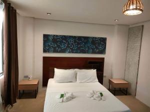 Postel nebo postele na pokoji v ubytování Hotel Rupert A Baler