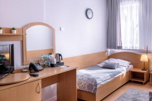 Posteľ alebo postele v izbe v ubytovaní Tailor Hotel Sport & Conference
