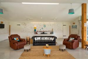 Posezení v ubytování SaffronStays Onellaa, Nashik - infinity pool villa surrounded by a vineyard