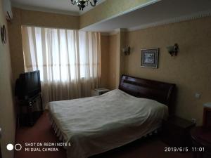 Postel nebo postele na pokoji v ubytování Hotel Botakoz