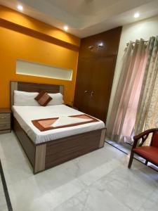מיטה או מיטות בחדר ב-Mahak Guest House By WB Inn