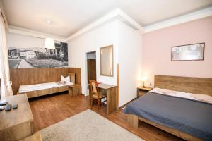 Posteľ alebo postele v izbe v ubytovaní Hotel Džbán