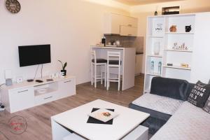 a living room with a couch and a table at Studio - Stan na dan Nina - Pale Centar in Pale