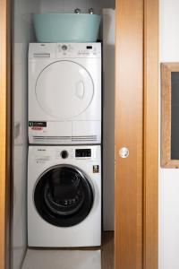 a white washer and dryer in a room at Calm Home La Tejita in Granadilla de Abona