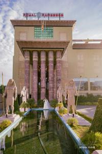 a building with statues of men in front of it at Hotel Royal Ramesses - Katunayake in Seeduwa