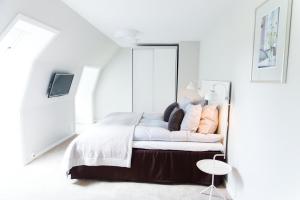 A bed or beds in a room at Rungstedgaard
