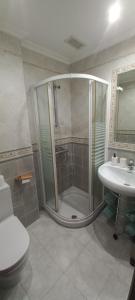 a bathroom with a shower and a toilet and a sink at Monterrey del Prior. in Salamanca +34 photos