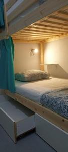 a bunk bed in a room with a bunk bedutenewayangering at Duque Nest Hostel in Adeje