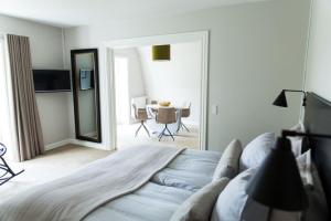 A bed or beds in a room at Rungstedgaard