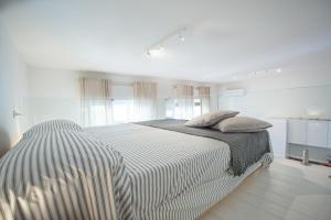 Posteľ alebo postele v izbe v ubytovaní Casa Ravenna - Pescara Centro