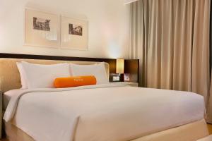 Voodi või voodid majutusasutuse HARRIS Hotel & Conventions Malang toas