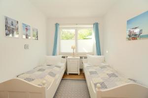 Postel nebo postele na pokoji v ubytování Ferienwohnung Seestern in zentraler Lage von Eckernförde