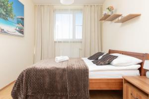Posteľ alebo postele v izbe v ubytovaní Belgradzka Apartment Warsaw by Noclegi Renters