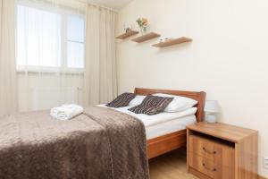 Posteľ alebo postele v izbe v ubytovaní Belgradzka Apartment Warsaw by Noclegi Renters