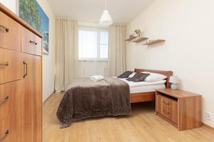 Posteľ alebo postele v izbe v ubytovaní Belgradzka Apartment Warsaw by Noclegi Renters