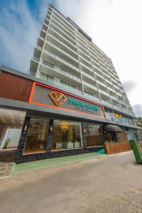 a large building with a real grand hotel at Pearl Grand By Rathna in Colombo