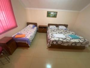 Giường trong phòng chung tại Beryozovy Guest House