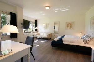 Ένα ή περισσότερα κρεβάτια σε δωμάτιο στο Hotel Skanderborghus