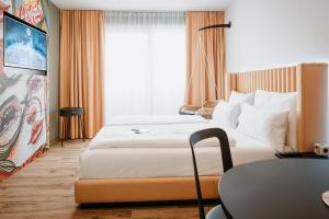 Postel nebo postele na pokoji v ubytování Rioca Vienna Posto 2