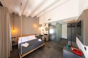 a bedroom with a swinging bed in a room at Villa Totò Resort in Cefalù