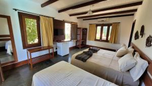 Postel nebo postele na pokoji v ubytování Taipabas Hotel