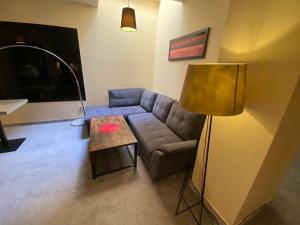 a living room with a couch and a table at City Apartment Getta in Krakow