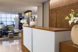 a lobby of a hotel with a reception desk at NH Collection Buenos Aires Crillón in Buenos Aires