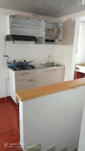 a kitchen with a sink and a counter top at El mirador Raquireño ma in Ráquira