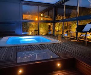 a large swimming pool on the deck of a house at Demeure Terrisse La Résidence in Marseillan