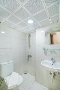 a bathroom with a toilet and a sink at Apartments Near to City Center and Beach in Marmaris